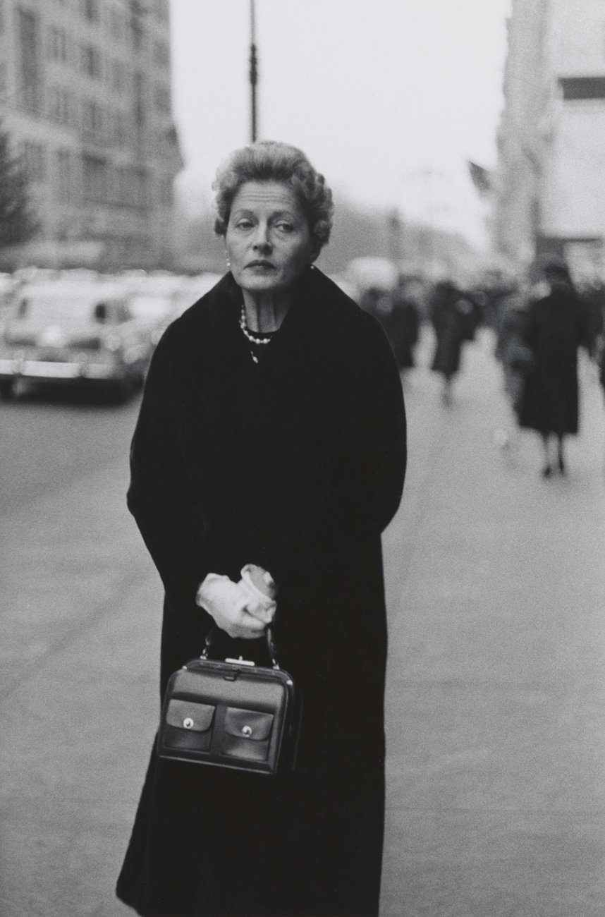 Woman with white gloves and a packet book  nyc  1956