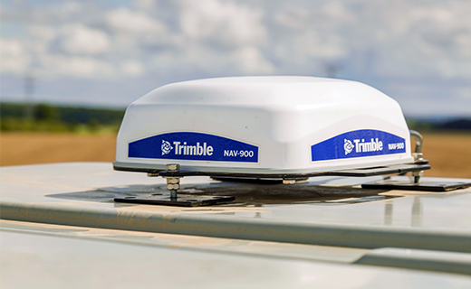 Trimble's NAV-900 guidance controller mounted to the roof of a tractor.