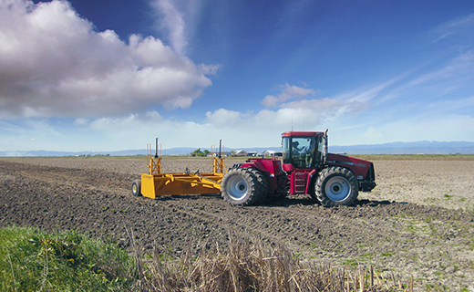 A farmer uses Trimble's FieldLevel II system for land forming activities.