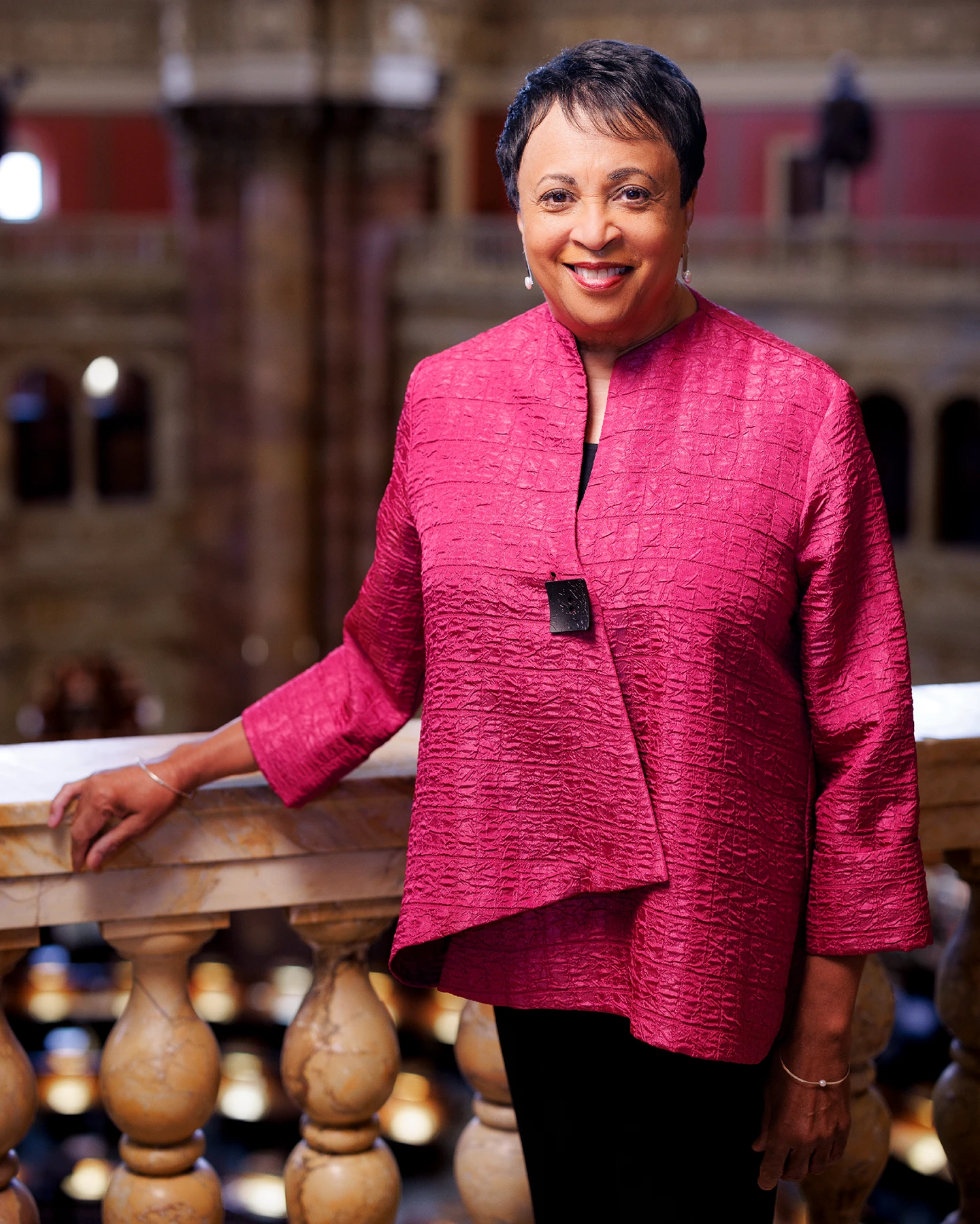 Dr. Carla Hayden stands on a balcony