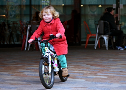 Child riding a bike.
