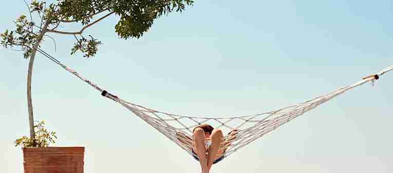 Child in hammock, on holiday with TUI
