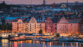 Kungsholmen - buildings by river at sunset_16_9