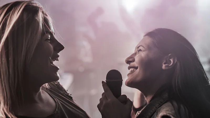 Girls singing karaoke