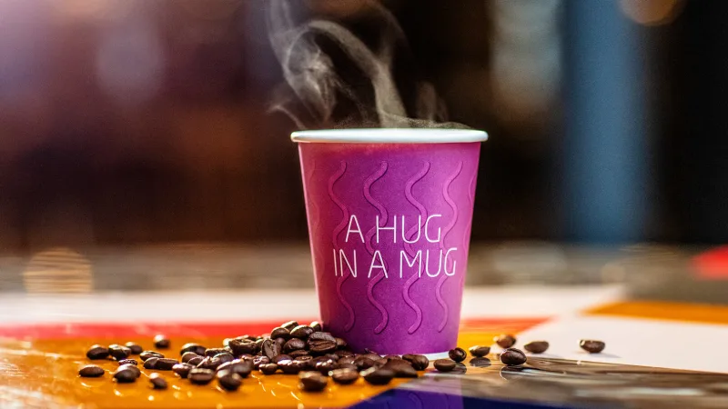 Coffee at Quality Hotel in a purple mug that says: a hug in a mug.