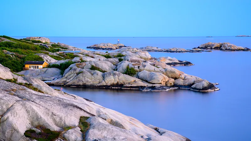 coastal line of Sandefjord with a single yellow house