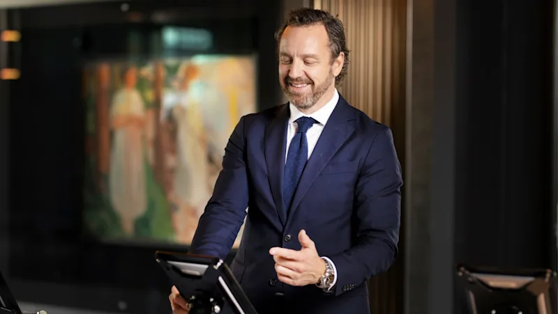 Business man checking in at a self service station