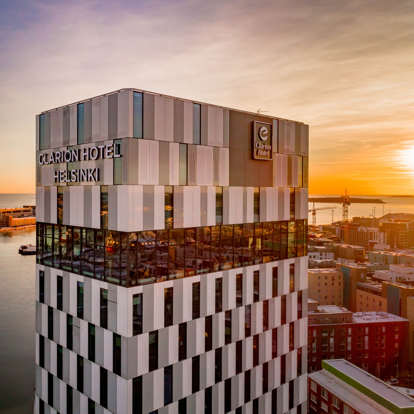 Exterior of Clarion Hotel® Helsinki in the sunset. 