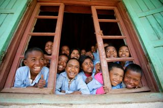 Happy kids in window UNICEF