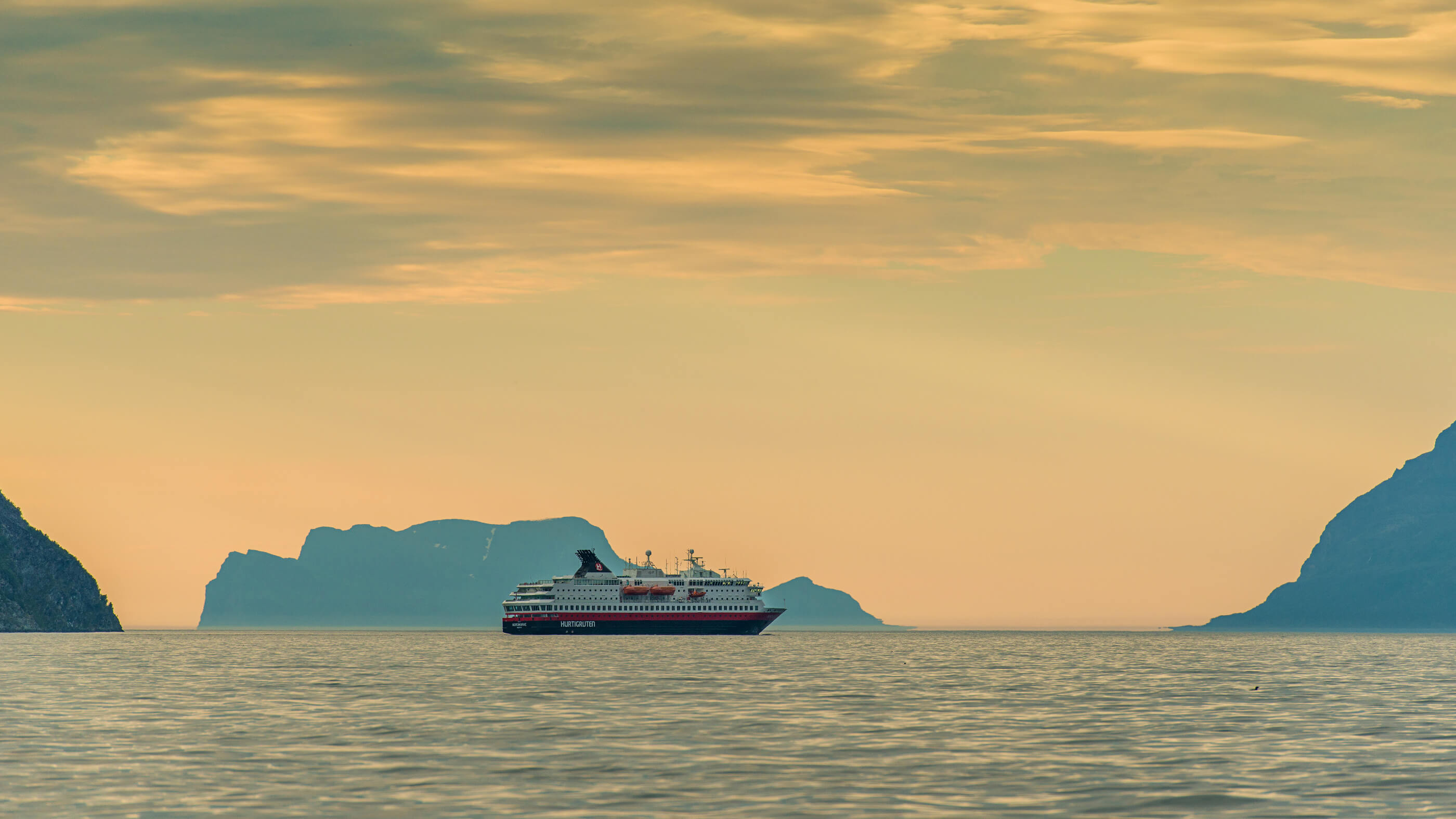 Hurtigruten ship at sea in sunset_16_9