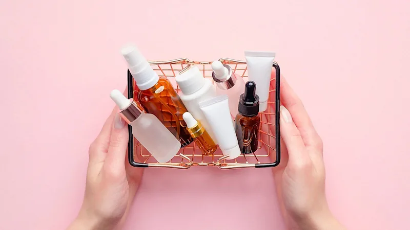 A basket filled with makeup and beauty products.