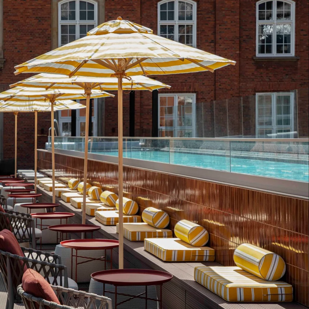 Lounge chairs by the pool at Villa Copenhagen.