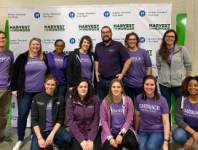 A group of Embrace Employees volunteering at an event