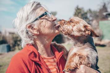 Senior owner with dog