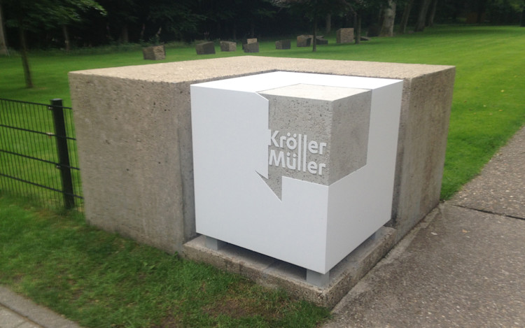 The logo in 3D which marks the entrance to the sculpture garden.