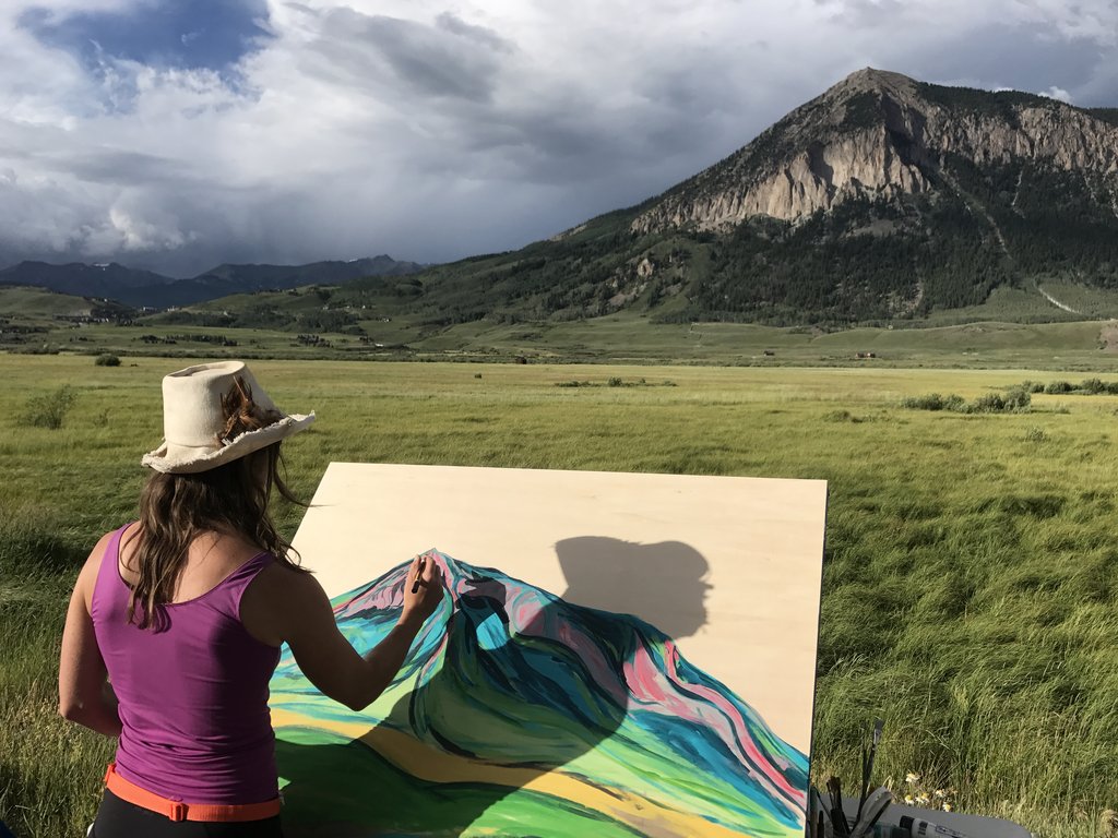 sarah painting in the mountains