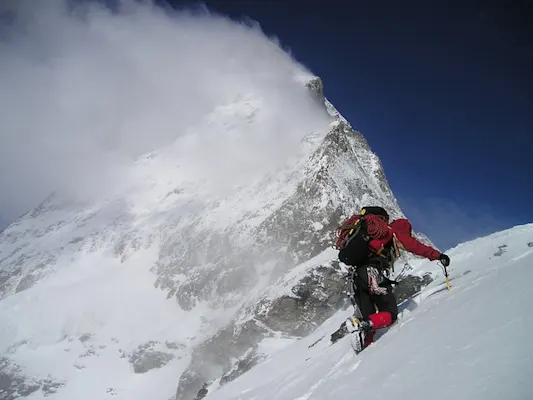 Man mountaineering | A man in boots mountaineering