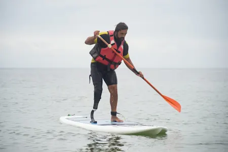 man paddleboarding | man paddleboarding