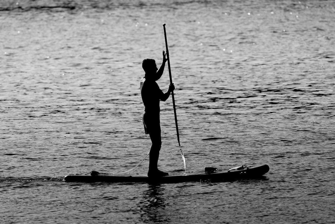 Man Standing on a Paddleboard | Man Standing on a Paddleboard