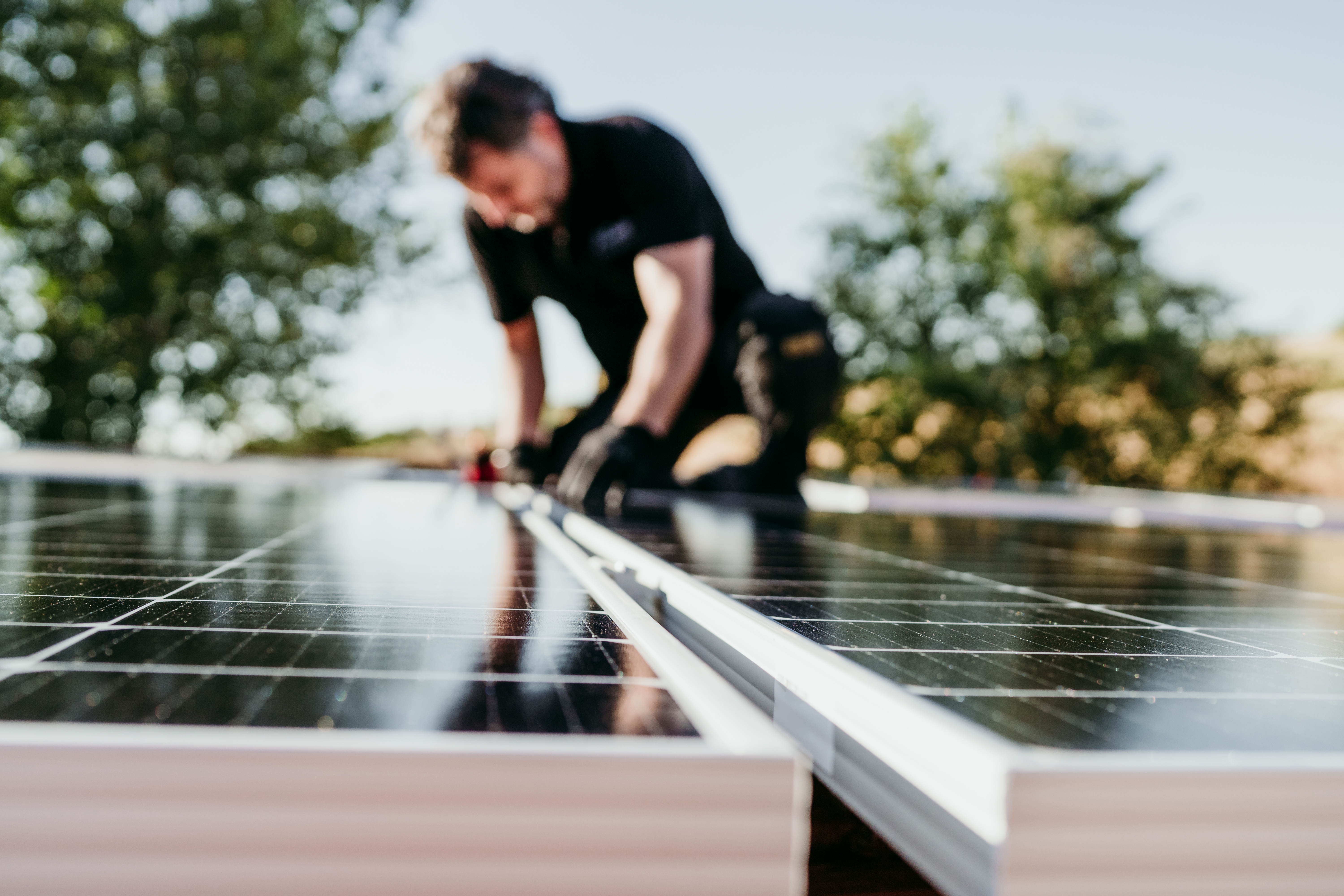 Technician Installing Solar Panels