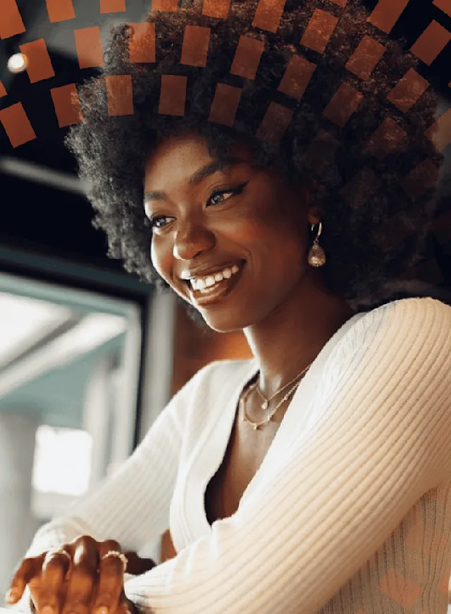 Smiling woman working on computer