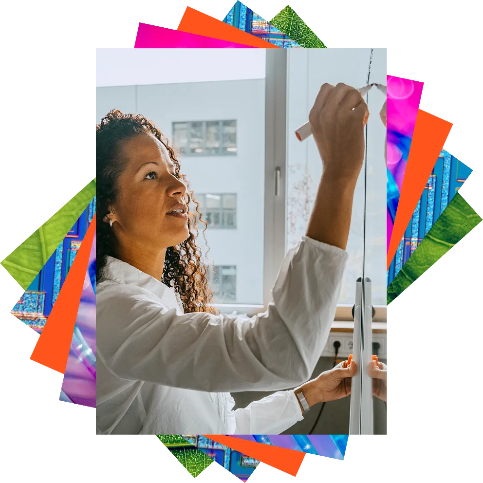 Stack of images layered on top of each other. The main photo is a confidence businesswoman who is drawling on a whiteboard.