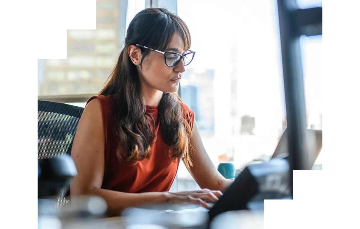 Woman working on her laptop at home