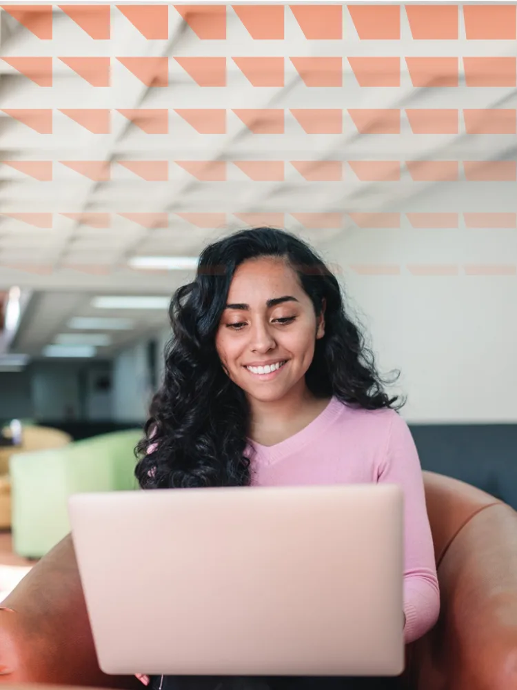 Young smiling latin american student woman using a laptop to study