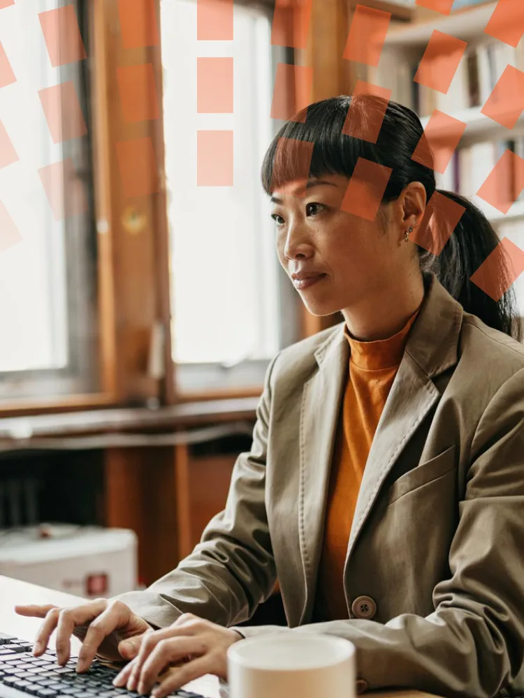 Businessman wearing glasses using a computer in his home office