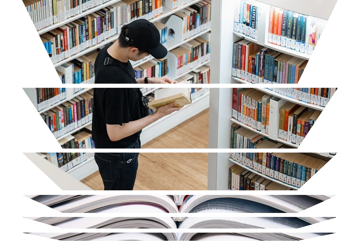 Young man taking books in a library