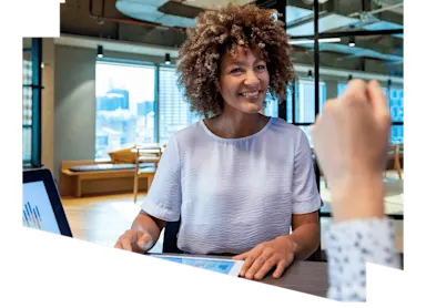 Woman discussing data with a colleague