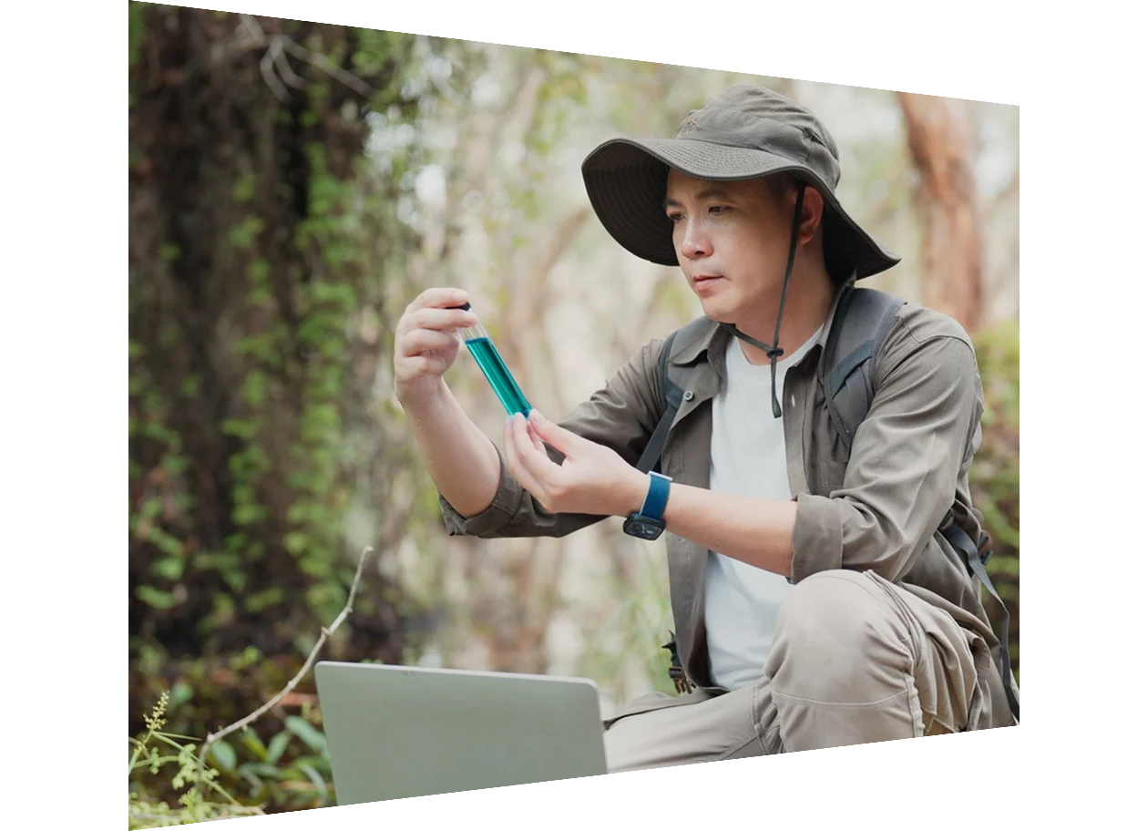 Researcher analyzing data with tablet outdoors