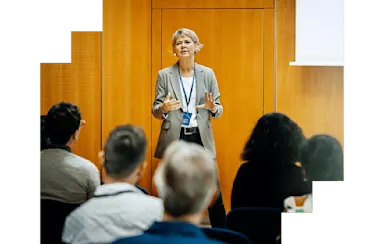 Professional woman presenting at a conference