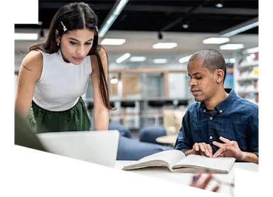 Woman helping blind student