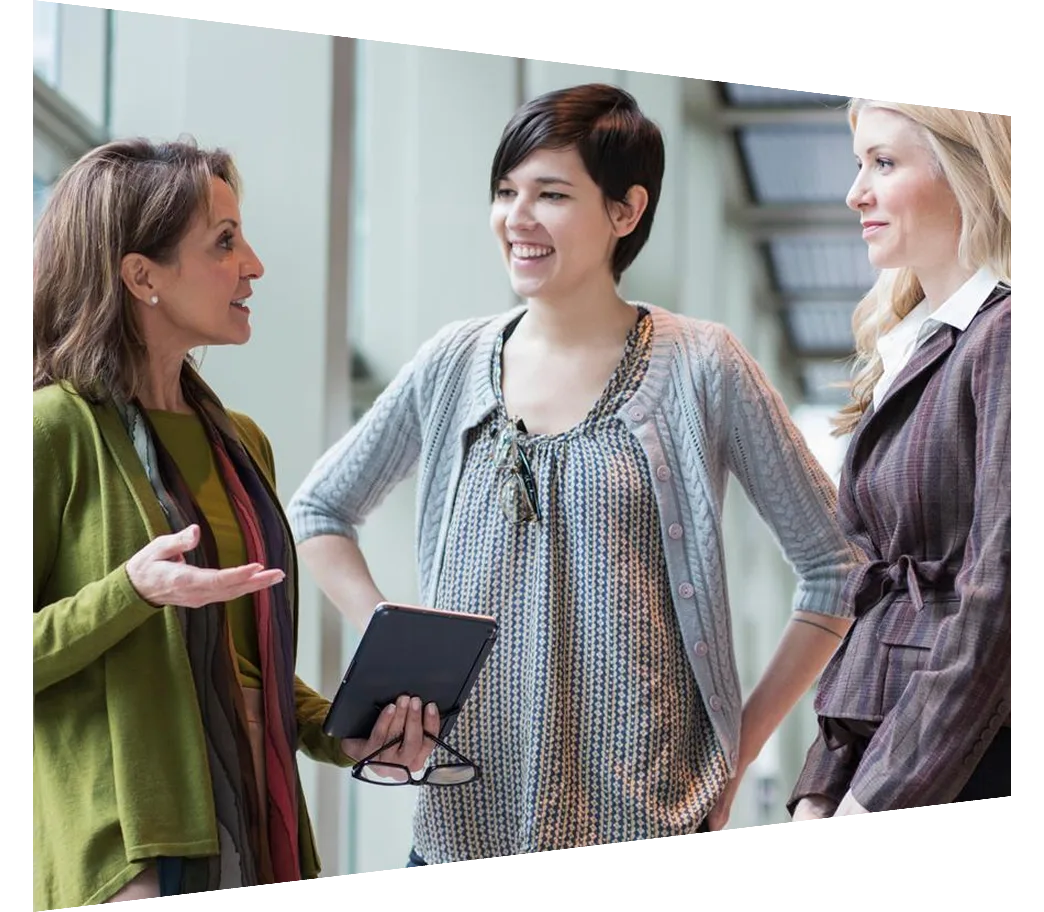 Businesswomen having a conversation in office lobby