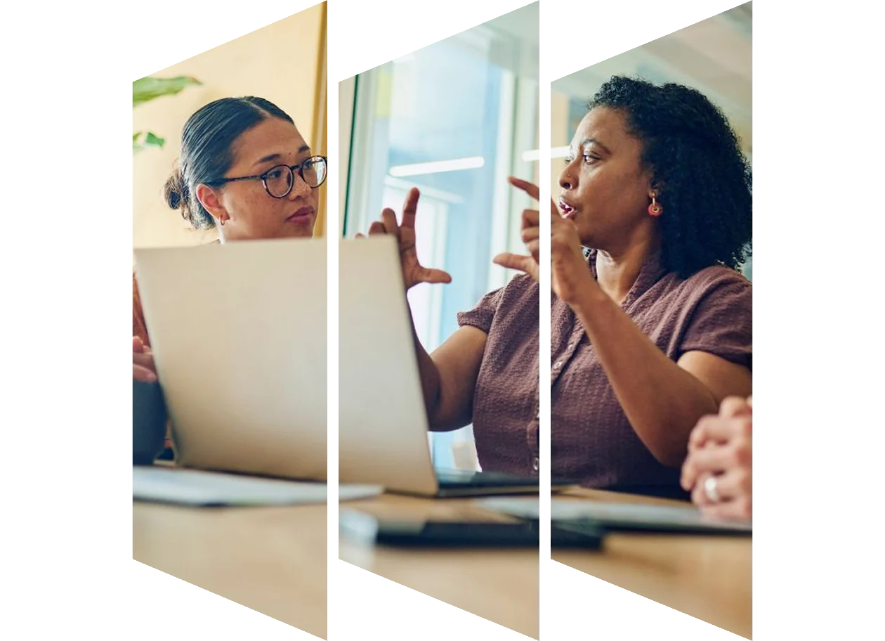 Colleagues discussing their system launch in the office