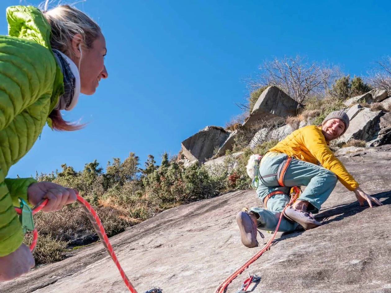 A symbolic photo of trust. Mountain climber belays teammate on multi-pitch route.