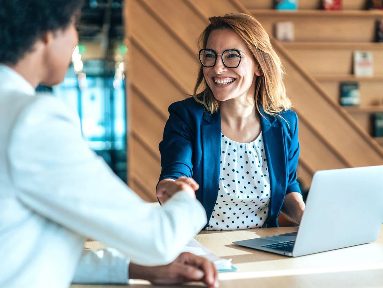 Two businesswomen shaking hands