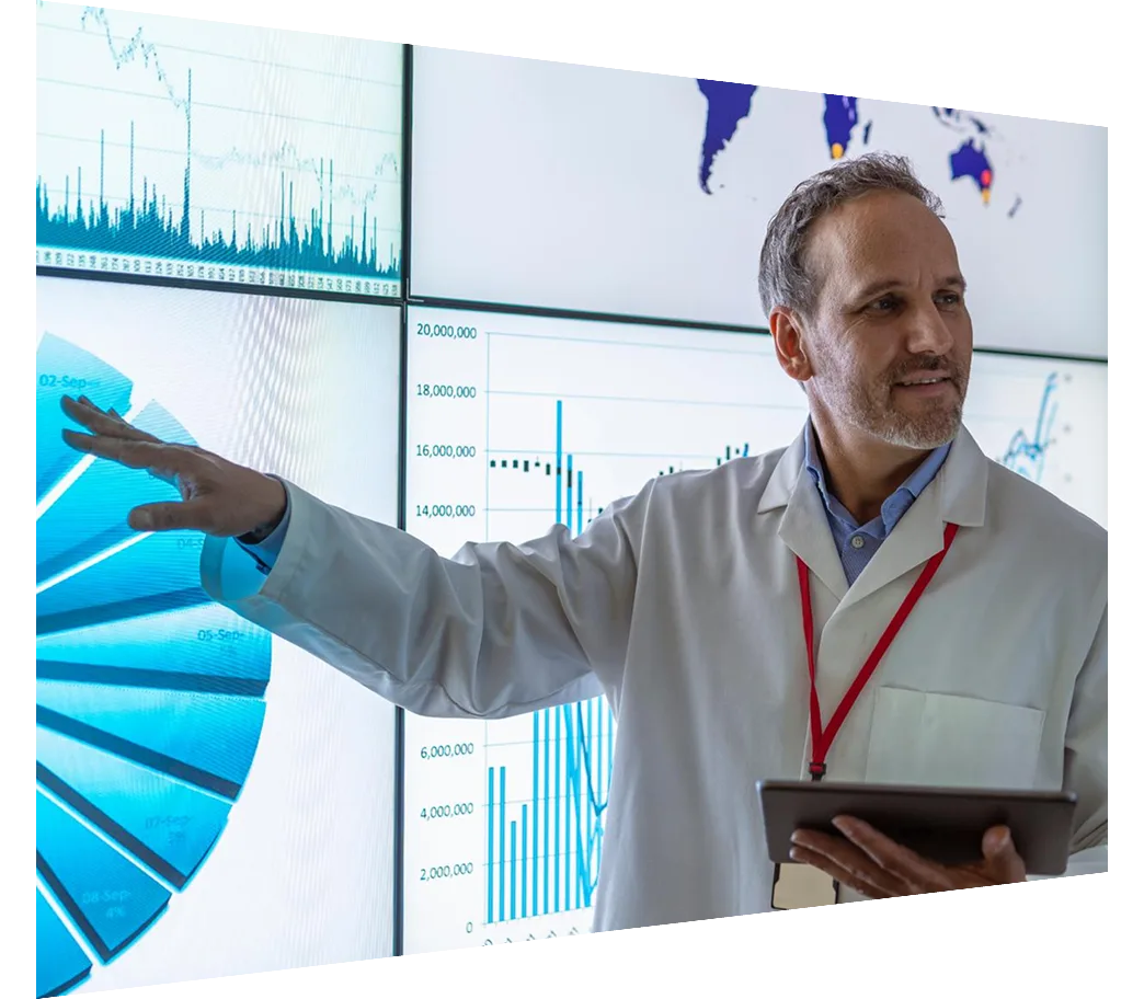 Researcher giving presentation with charts on interactive screens