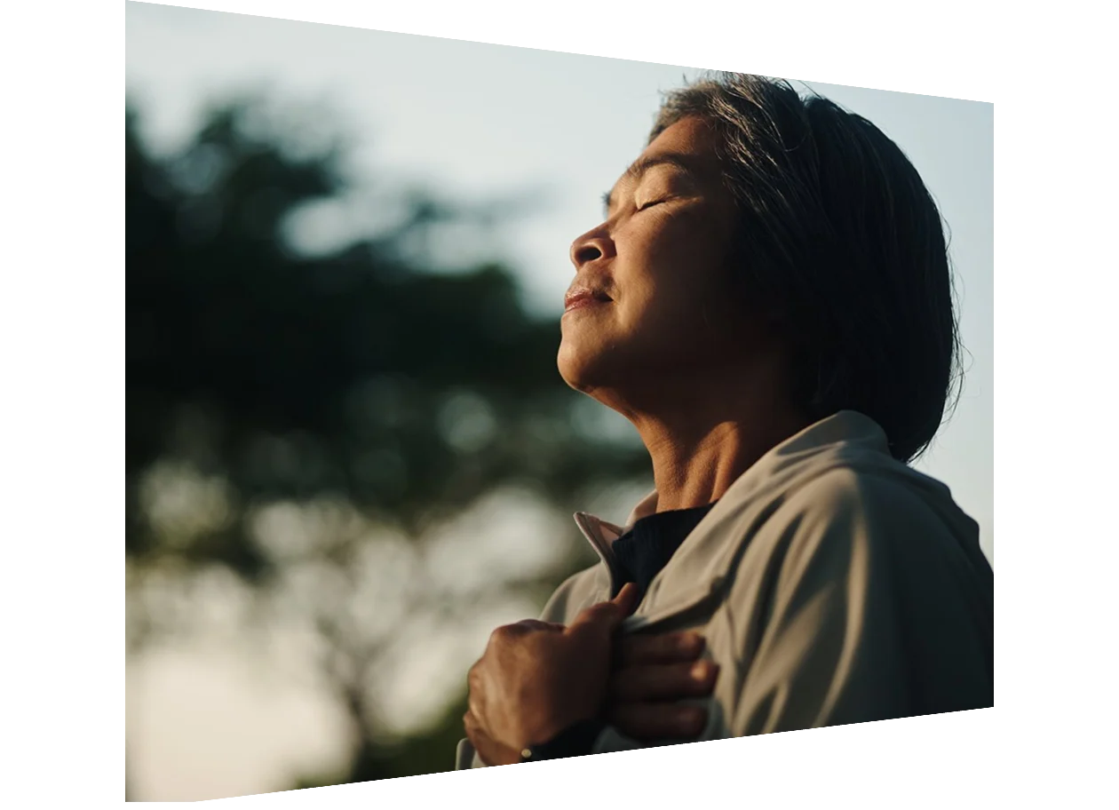 Man stretches while working