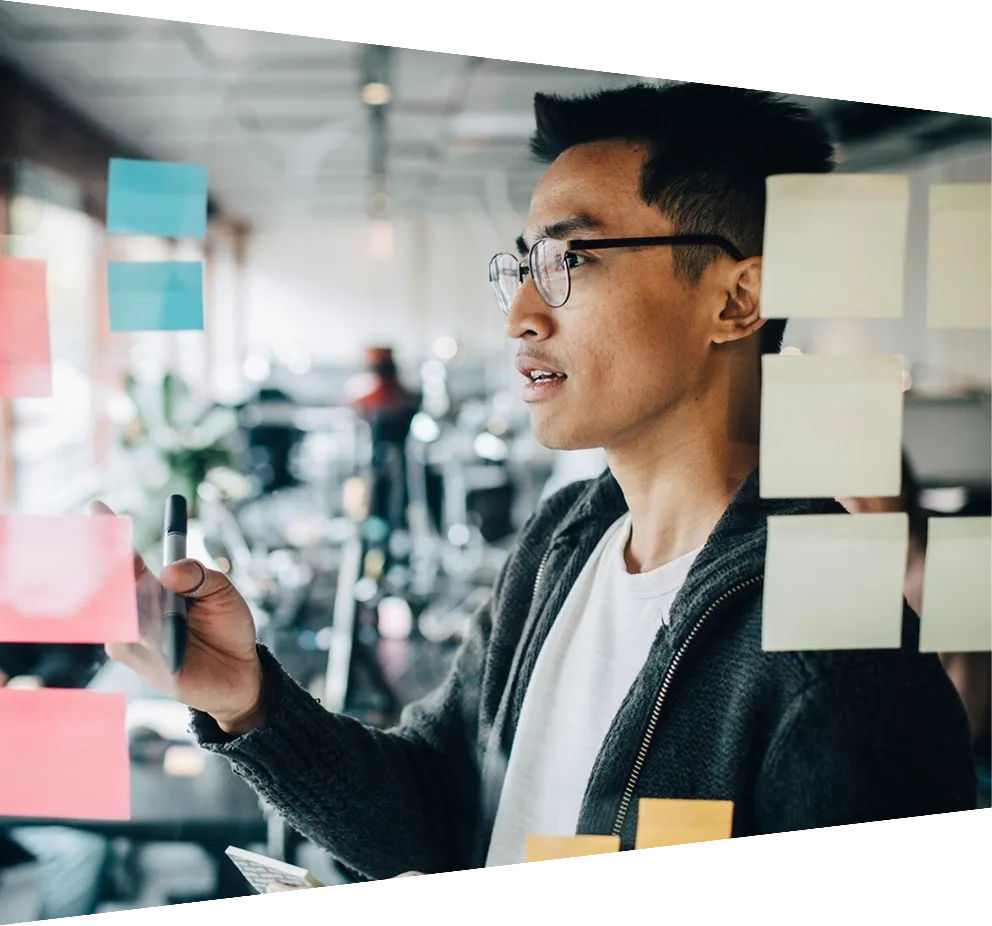 Close up of businessman writing down formulas