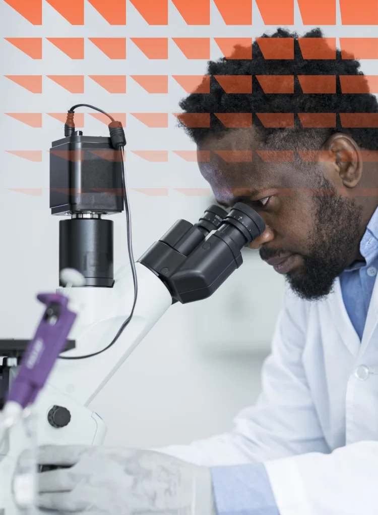 Clinician looking through microscope
