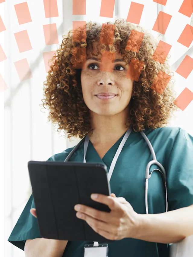 Thoughtful looking doctor with ipad