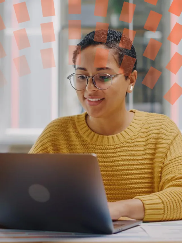 Female reviewer working on her laptop