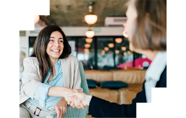 Two businesswomen shaking hands