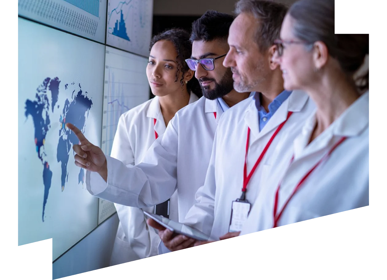 Team of researchers inspecting charts on interactive screens