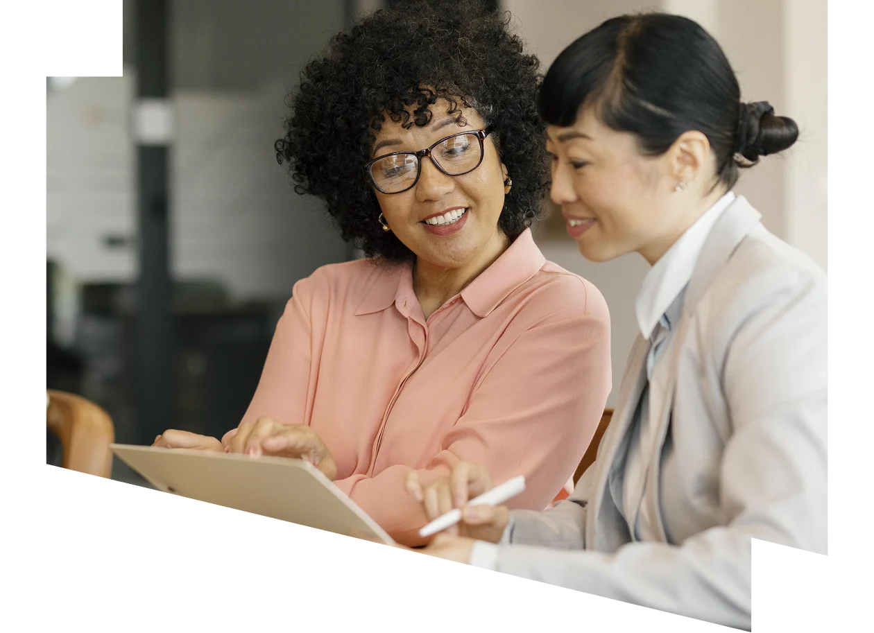 A group of people ascending the steps of a building, engaged in conversation.
