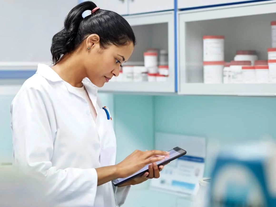 Pharmacist clinic ipad checking Benefit