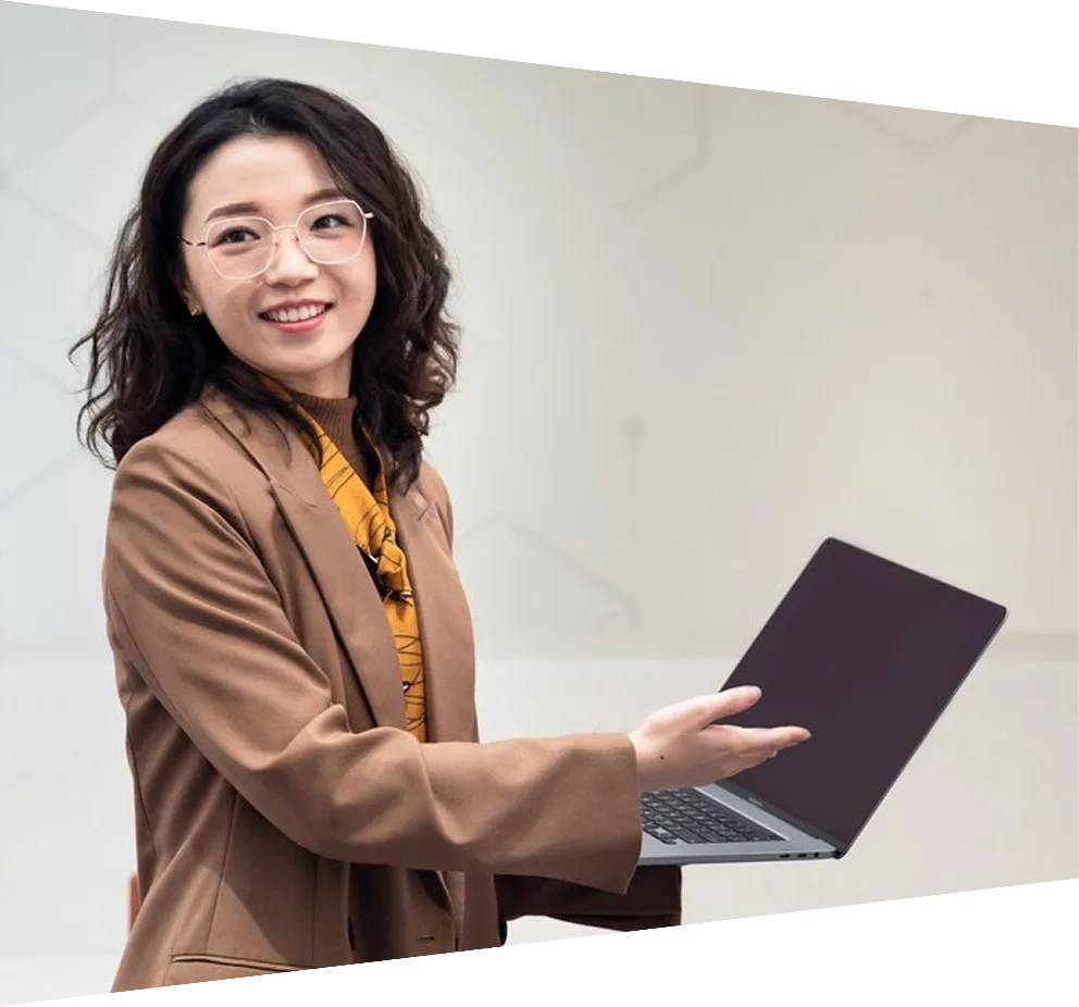 Elsevier Employee smiling and holding coffee in the office