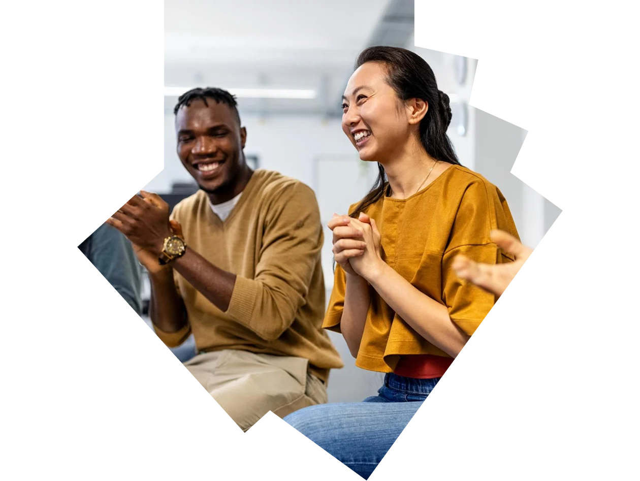 Back view of group of students raising their arms during a class at lecture hall